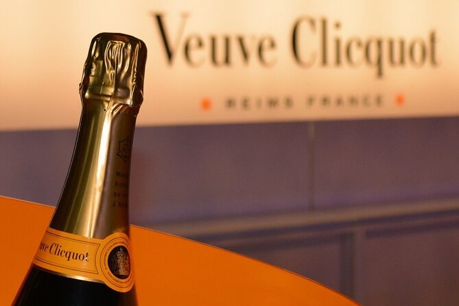 The neck of a Veuve Clicquot bottle before the house's sign, Reims France